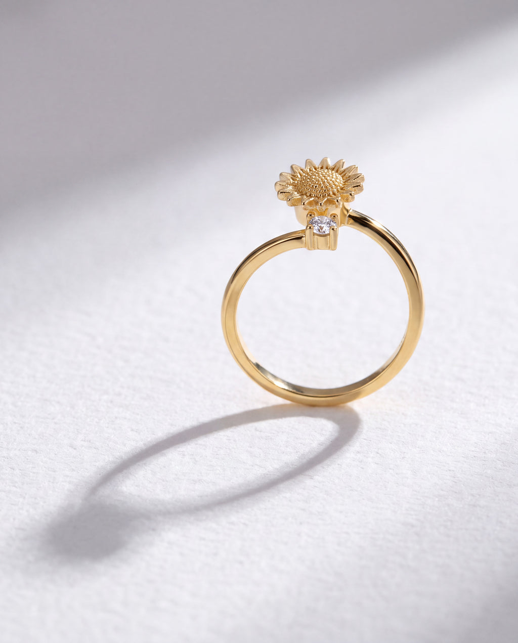 Basic Sunflower Serenara Anxiety Ring standing upright on white textured watercolor paper