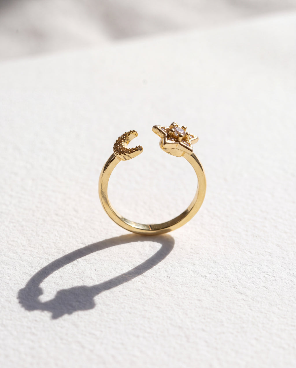 Star Moon Serenara Anxiety Ring standing upright on white textured watercolor paper