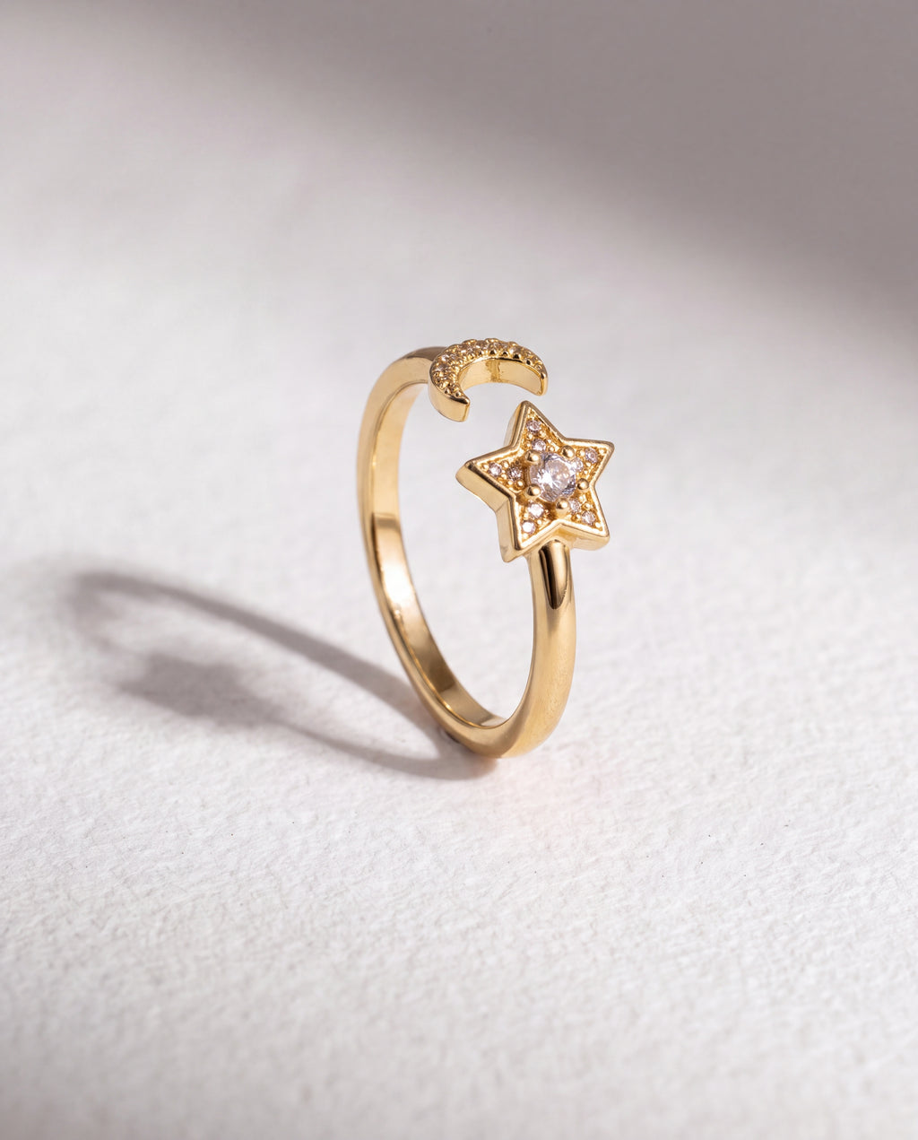Star Moon Serenara Anxiety Ring standing upright on white textured watercolor paper, soft shadow