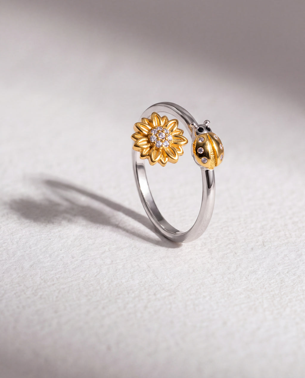 Ladybug Serenara Anxiety Ring standing upright on white textured watercolor paper