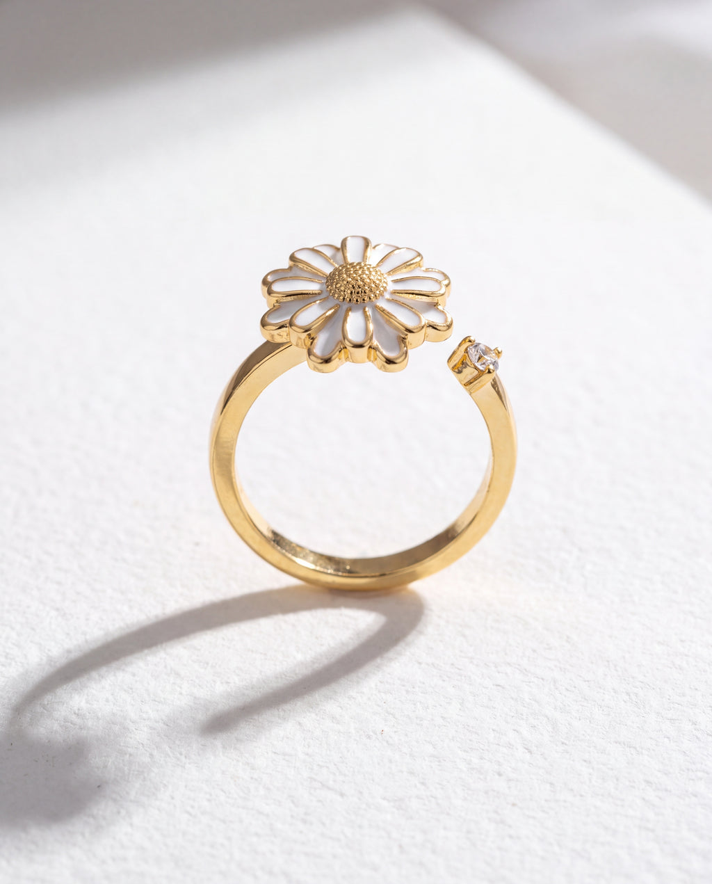 White Sunflower Serenara Anxiety Ring standing upright on white textured watercolor paper