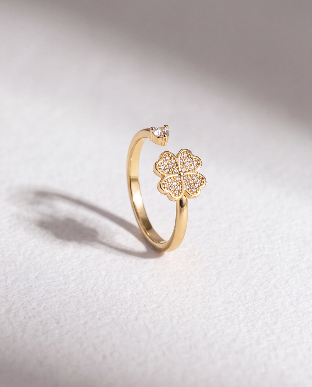 Clover Serenara Anxiety Ring standing upright on white textured watercolor paper, soft shadow