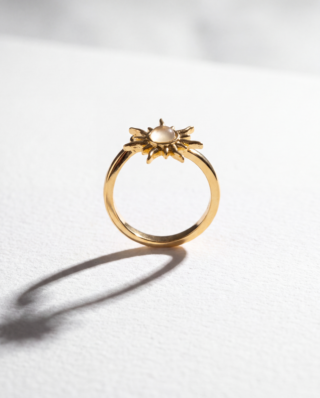 Sun Serenara Anxiety Ring standing upright on white textured watercolor paper