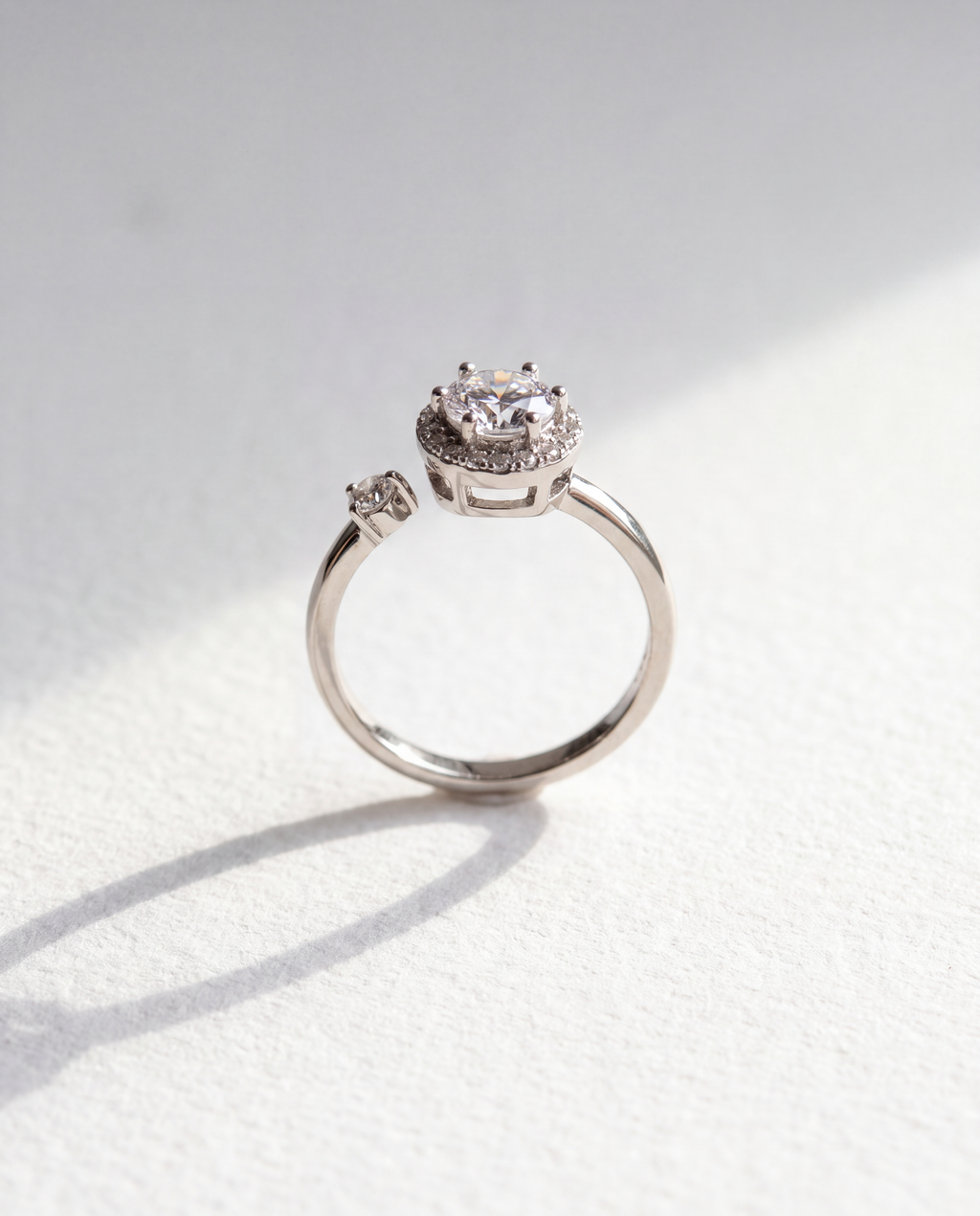 Basic Micro-inlaid Serenara Anxiety Ring standing upright on white textured watercolor paper, soft shadow